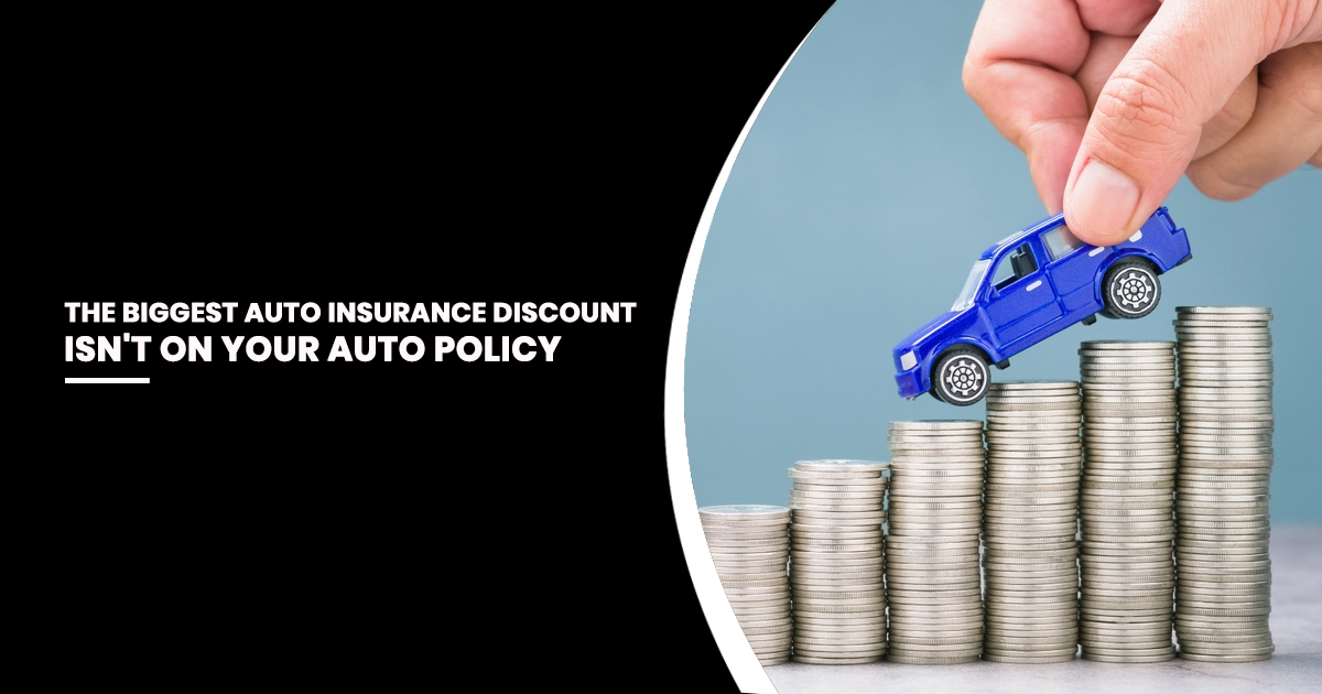 Toy blue car placed on stacks of coins illustrating auto insurance bundle discounts and insurance savings for Hobbs, New Mexico drivers.