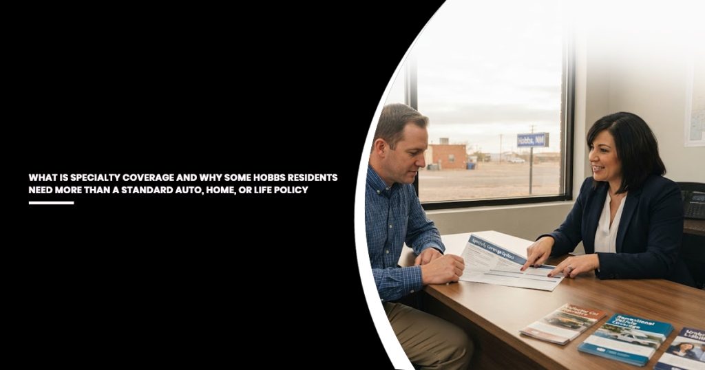Insurance agent in dark blazer and white blouse sits across from male client in blue plaid shirt at wooden desk, reviewing policy documents together in office with large windows overlooking Hobbs.
